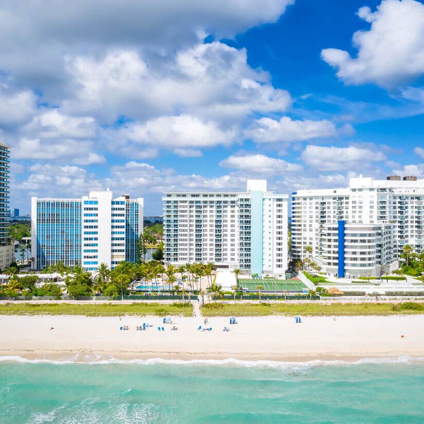 Aerial view of Seacoast Suites building and Miami Beach